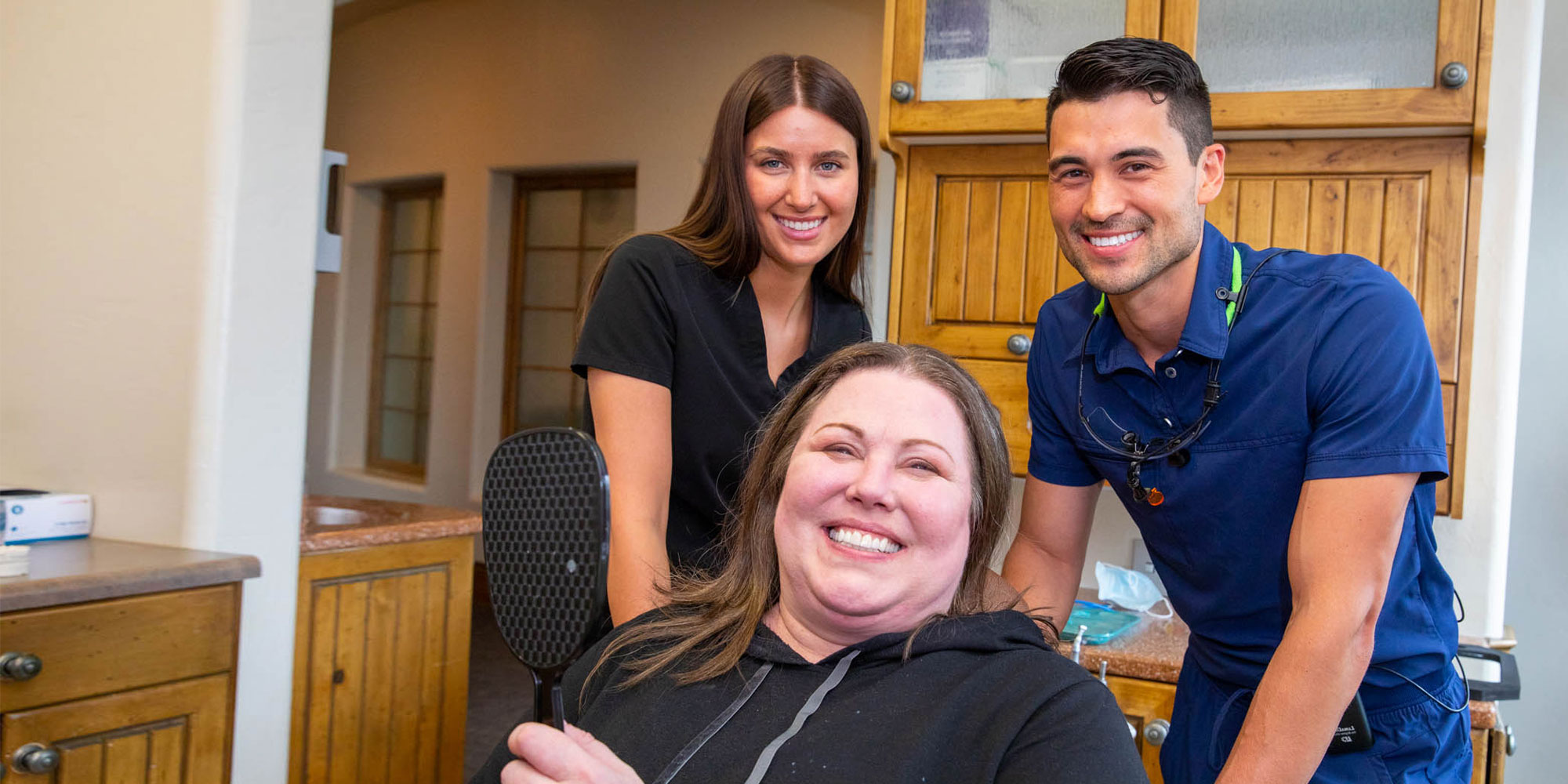 kris with dr sherman and assistant smiling