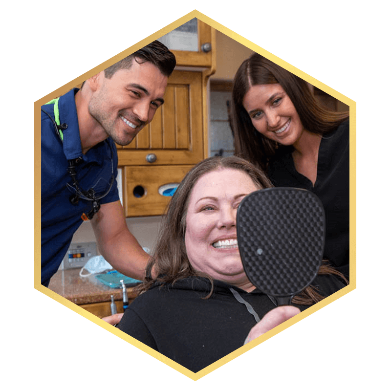 Patient and doctor looking into mirror