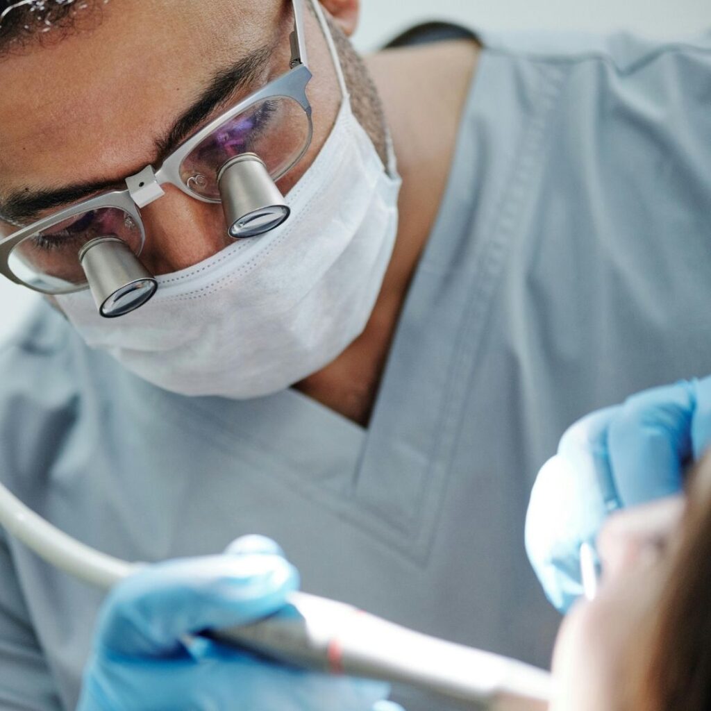 dentist working on a patient's mouth