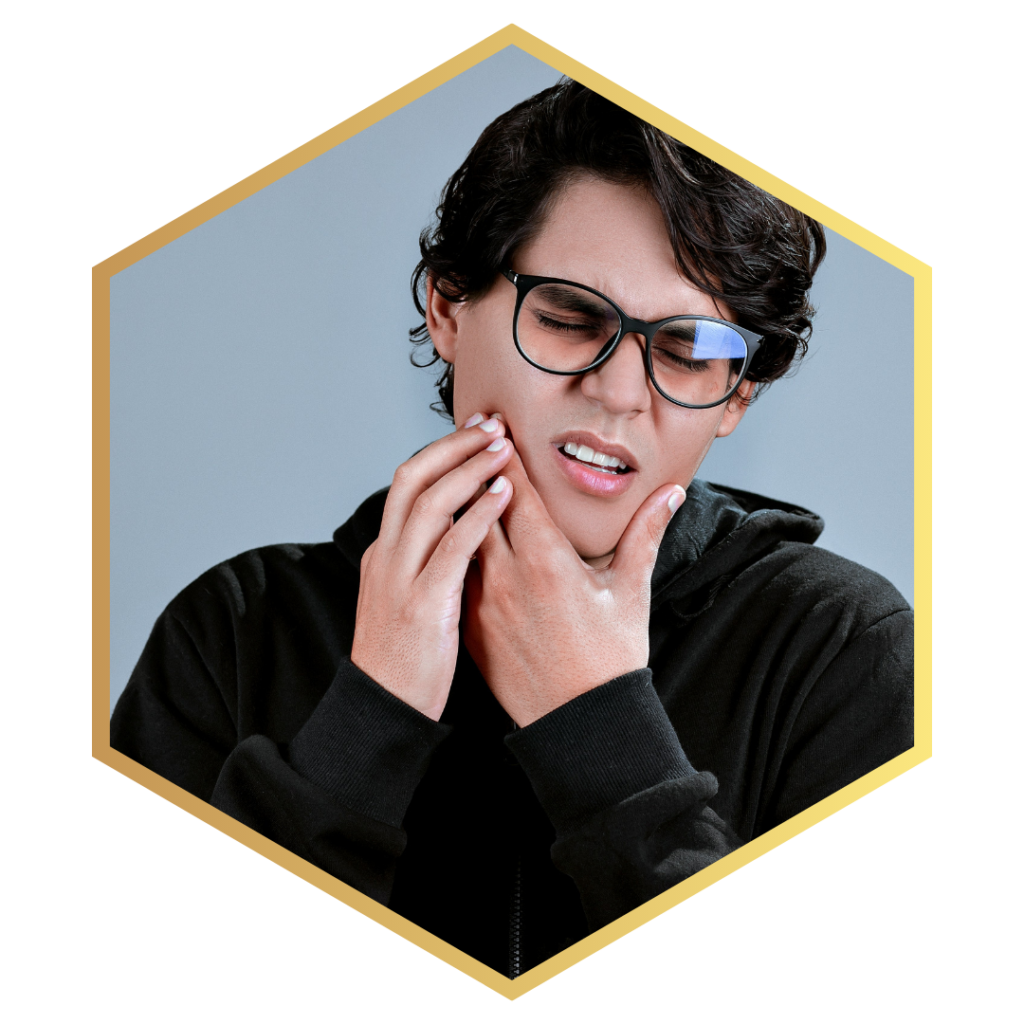 man holding jaw in pain