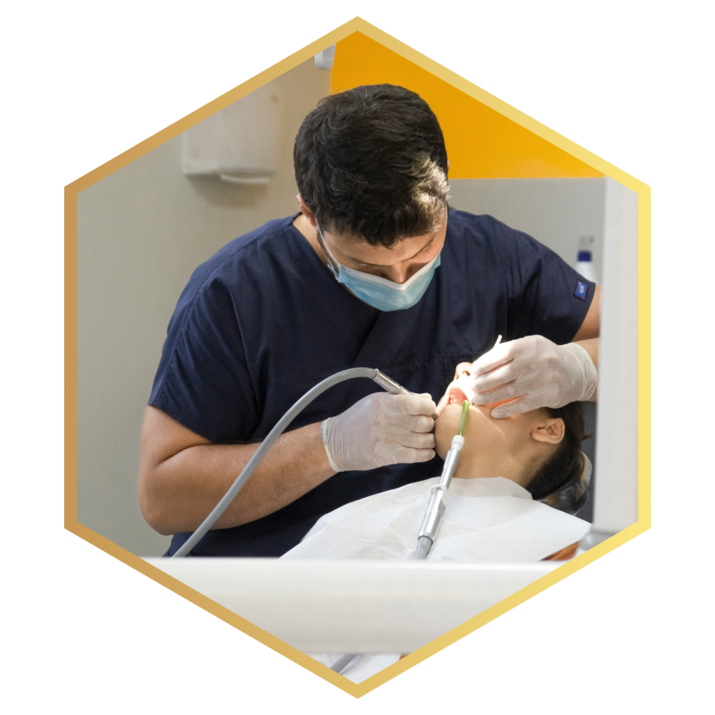 dentist working on woman's mouth