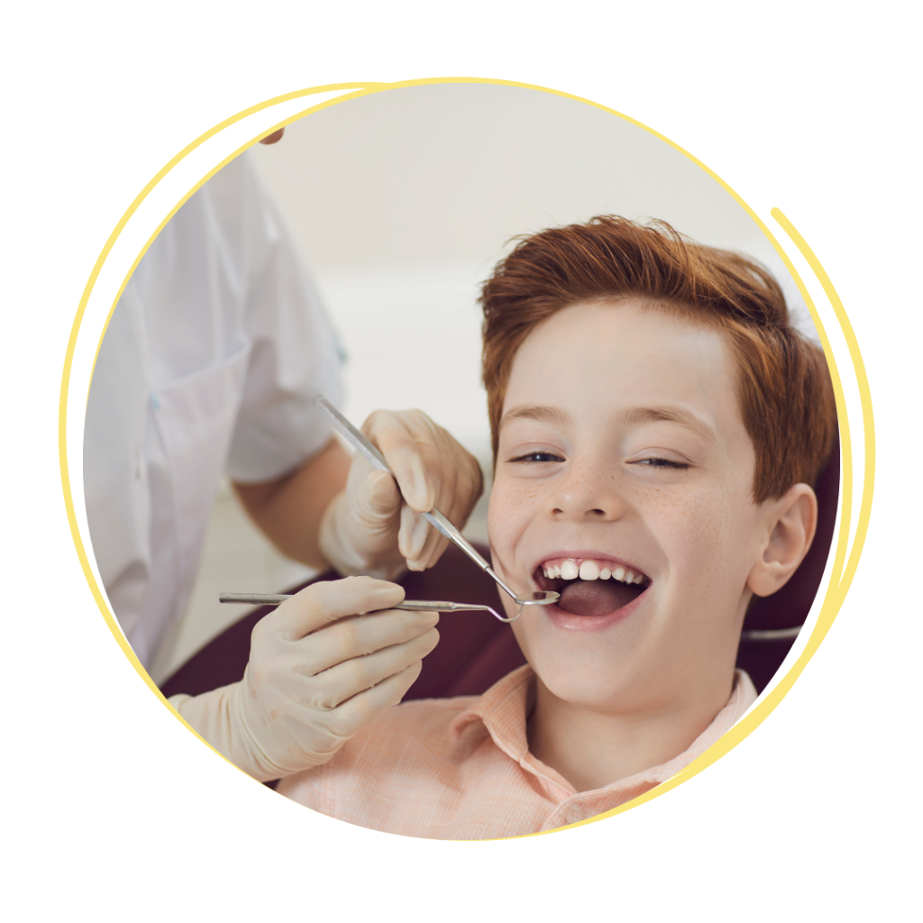 Image of a child getting his teeth examined