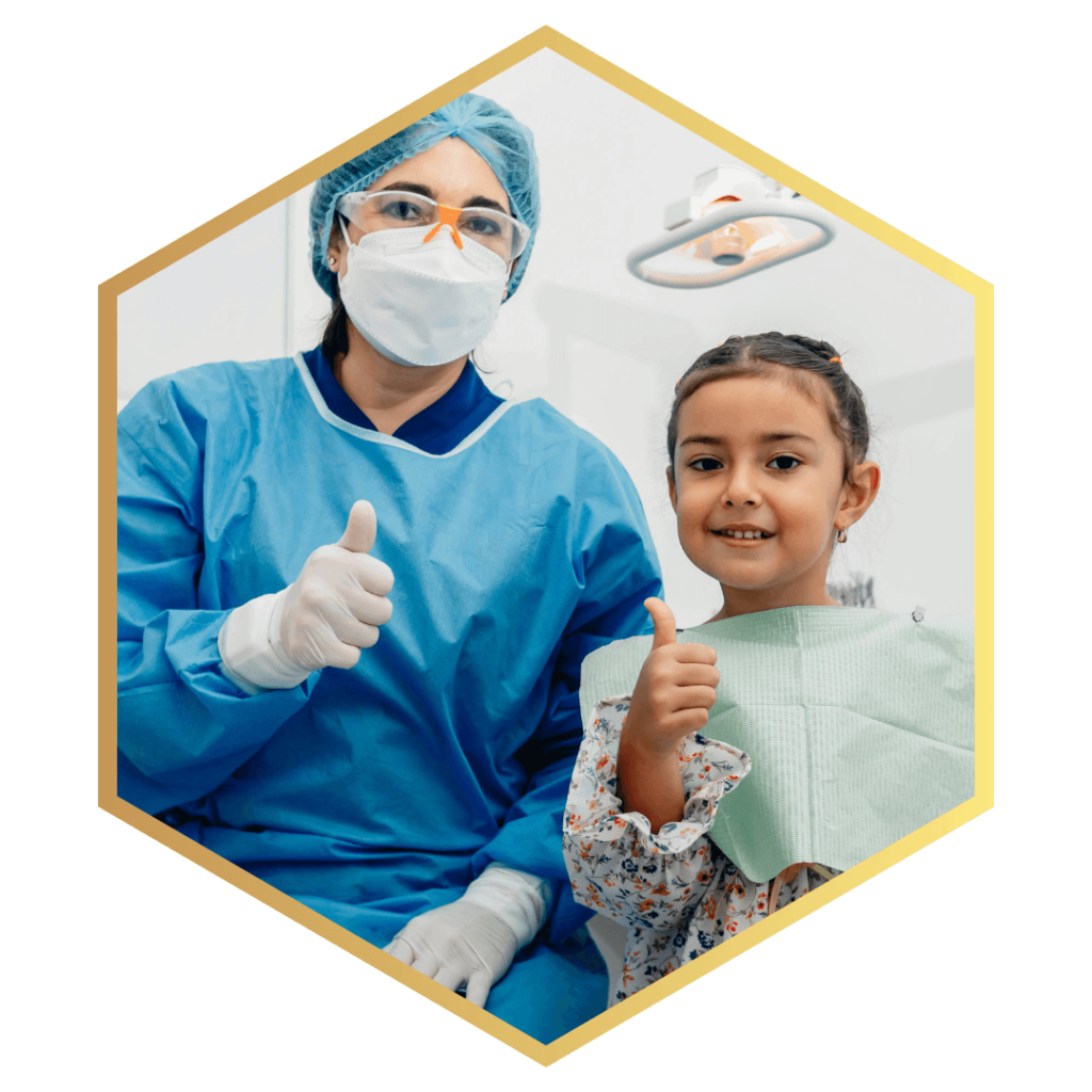 Image of a kid in a dentist chair with the dentist next to them
